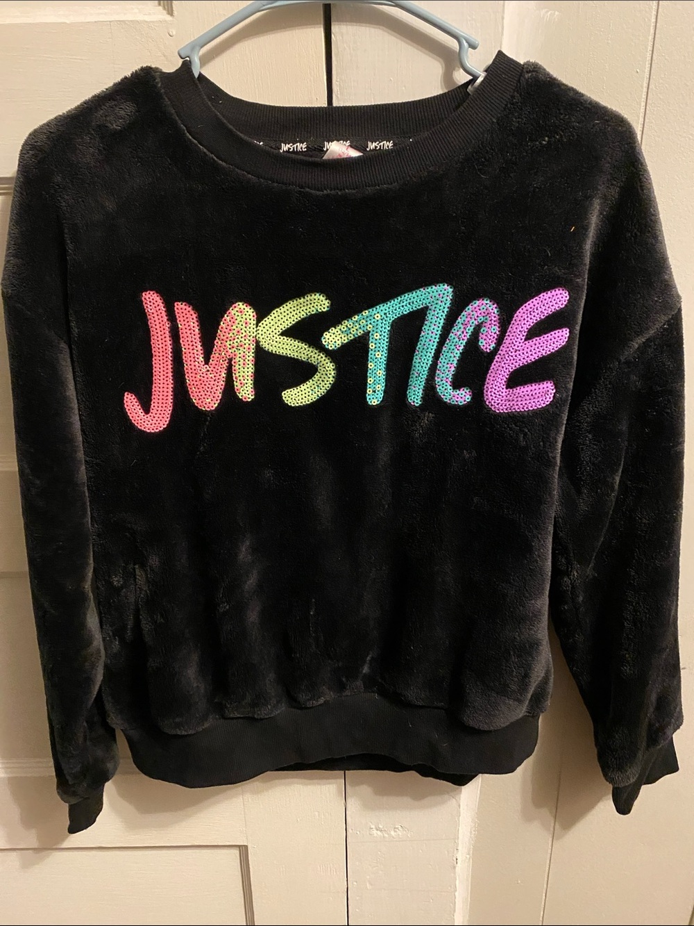 Justice Black Plush Crewneck with Rainbow Sequin Logo
